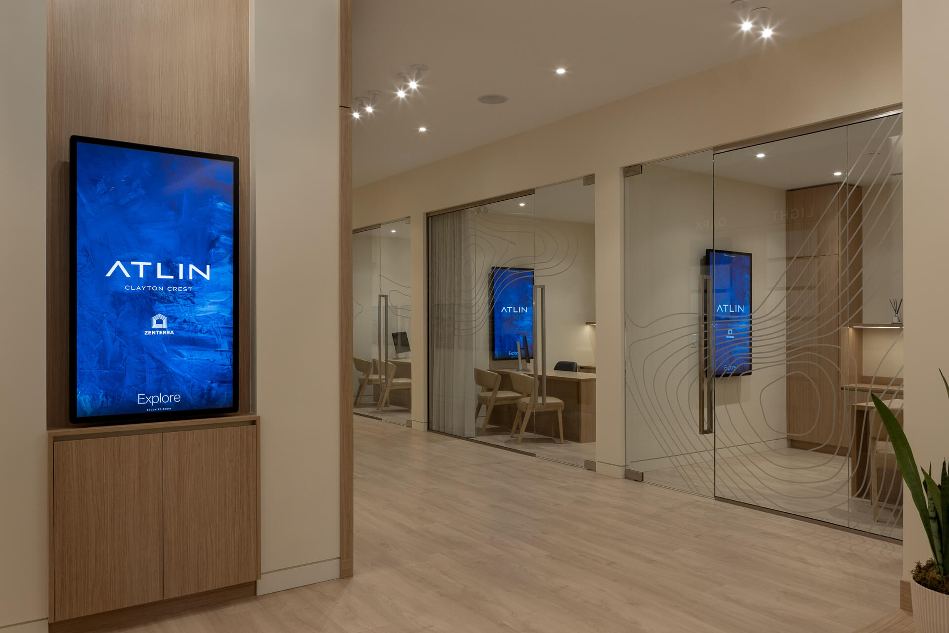 Display corridor and meeting rooms inside the Atlin presentation centre.